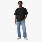 Male model wearing STF black tonal embroidered T-shirt front view