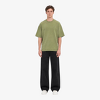 Male model wearing STF boxy oversized olive T-shirt front view