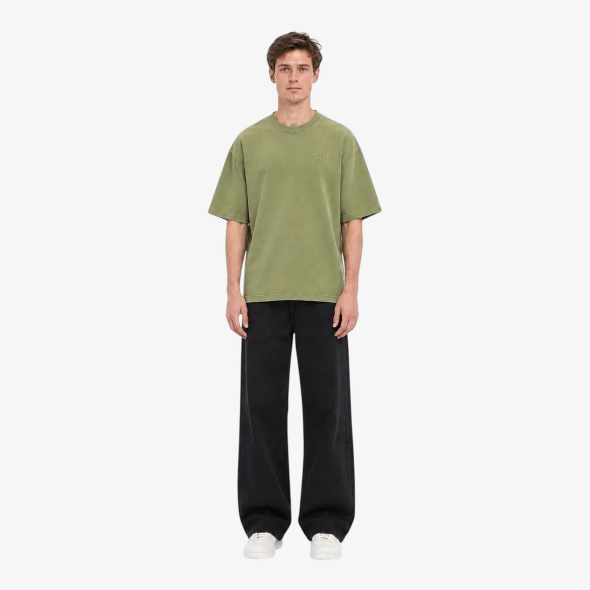 Male model wearing STF boxy oversized olive T-shirt front view