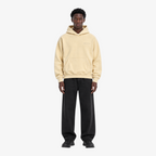 STF oversized boxy hoodie in cream — Male model front view