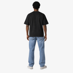 Male model wearing STF black boxy oversized T-shirt back view
