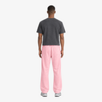 STF relaxed open-hem trousers in pink — Male model back