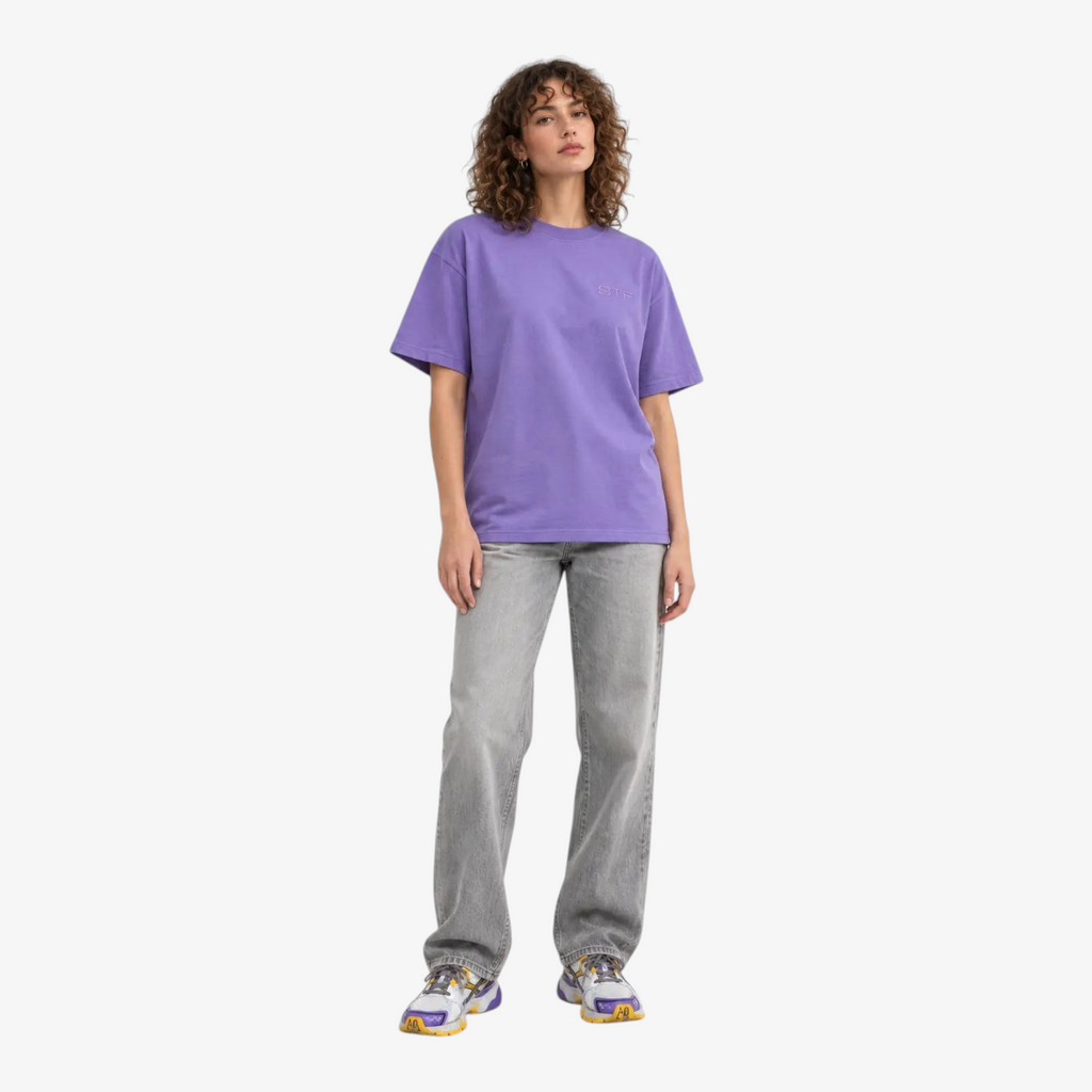 Female model wearing STF lavender tonal embroidered T-shirt front view