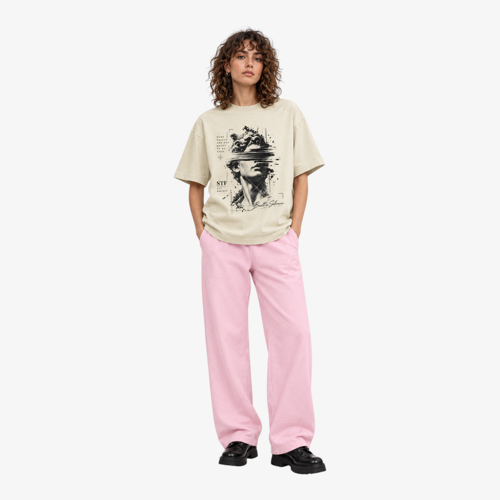 STF Statue Graphic T-shirt in cream — Female model front with pink wide-leg trousers