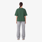Female model wearing STF forest-green boxy oversized T-shirt back view