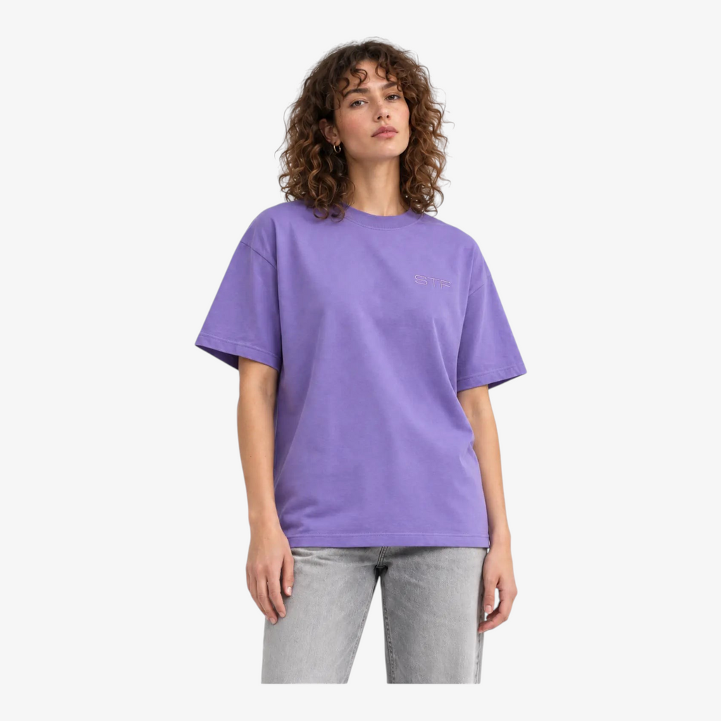 Female model wearing STF lavender T-shirt close-up