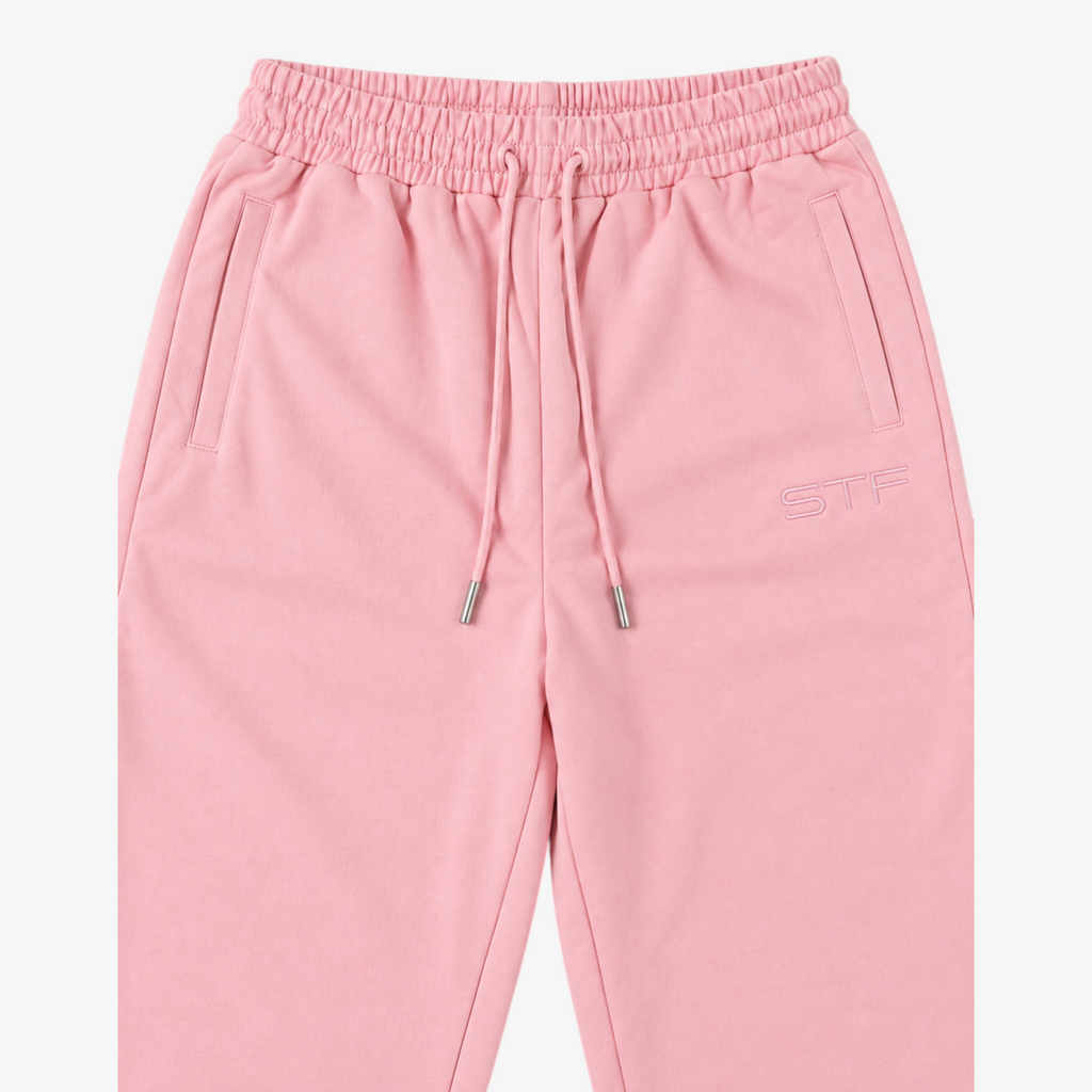 STF relaxed open-hem trousers in pink — Waistband and embroidery detail