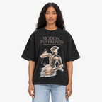 STF Motion in Stillness washed-black boxy oversized T-shirt — female closeup