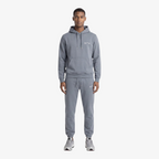 Model wearing Seejthreadsflames (STF) grey heavyweight cotton tracksuit with oversized hoodie and relaxed-fit joggers