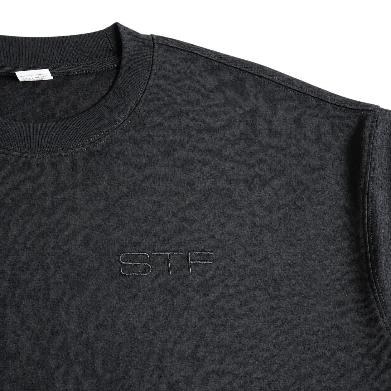 Seejthreadsflames (STF) black cotton French terry t-shirt featuring tonal embroidered logo and ribbed crew neckline.