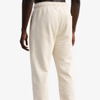 Back view of Seejthreadsflames (STF) cream heavyweight joggers with elasticated waistband and relaxed fit